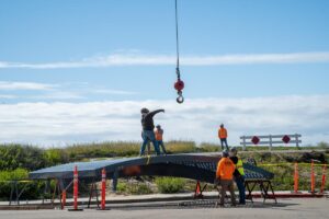 crane picking up new arch